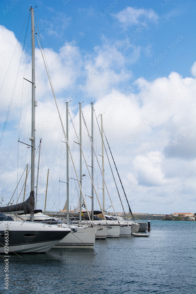 Sailing yachts lined up in Mahon marina, Menorca.