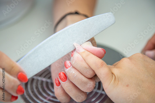 Close up of Beautician Emery Nail File in Beauty Manicure Salon