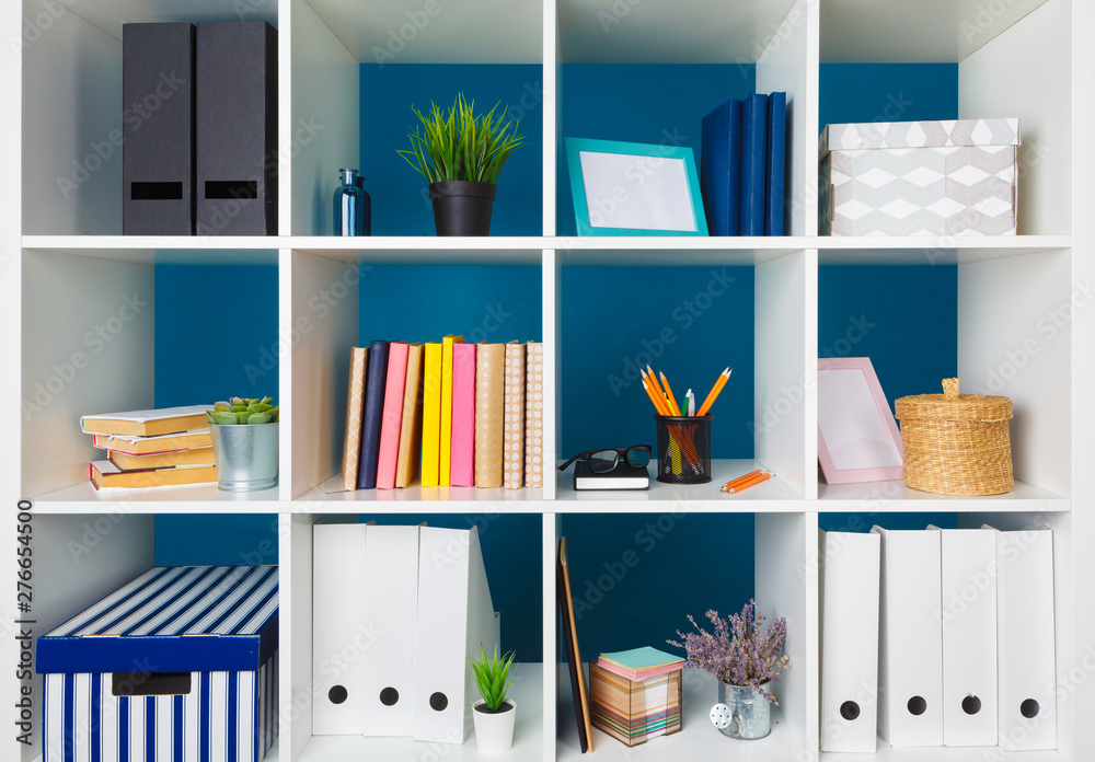 White office shelves with different stationery, close up - obrazy, fototapety, plakaty 