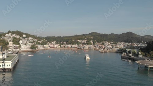 Wallpaper Mural Aerial approach into a coastal village located in a beautiful ocean bay. Torontodigital.ca