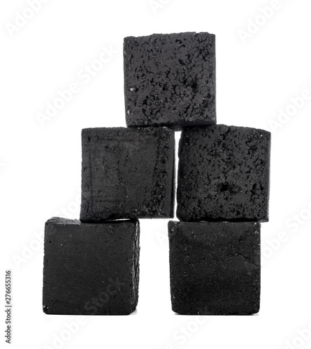 Group of charcoal cubes isolated on white background