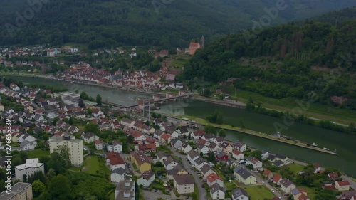 Aerial of the town Ersheim close to the castle Hirschhorn at the river Neckar on sunny day in spring. Pan to the left. photo