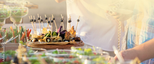 Obraz na plátně catering table set service with silverware and glass stemware at restaurant befo