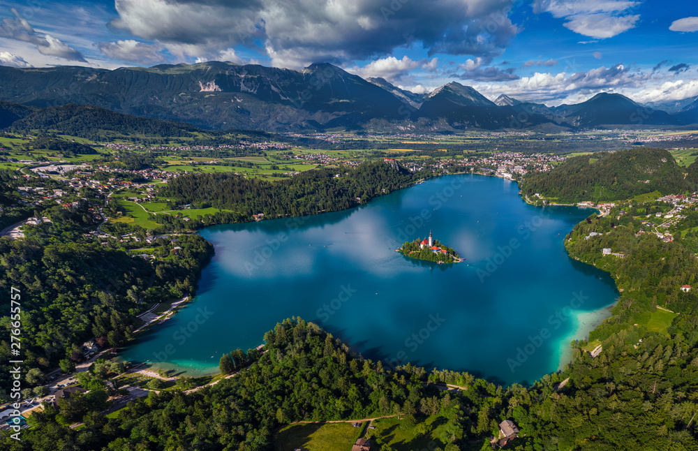 Obraz premium Bled, Slovenia - Aerial panoramic skyline view of Lake Bled (Blejsko Jezero) from high above with the Pilgrimage Church of the Assumption of Maria, Bled Castle and Julian Alps at background at summer