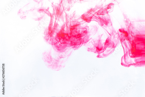 pink paint diluted in water on a white background