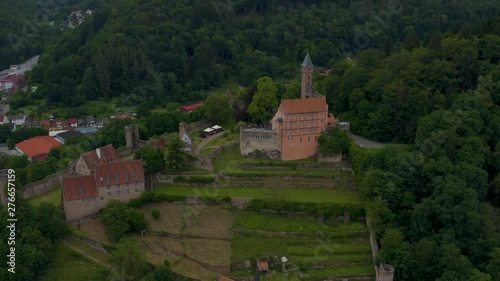 Aerial of the castle Hirschhorn in Germany beside the river neckar. Zoom in on to the castle. photo