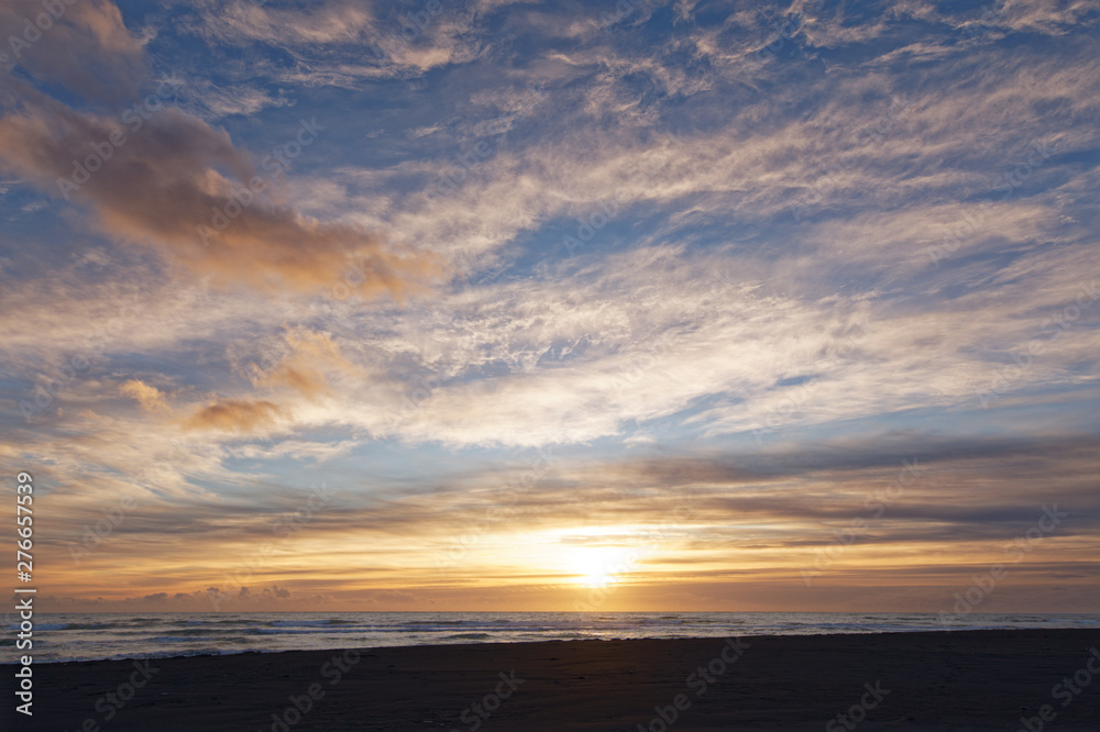 Sunrise over the sea at Diamond Beach with black lava sand at Jökulsarlon in Iceland Sunrise over the sea at Diamond Beach with black lava sand at Jökulsarlon in Iceland