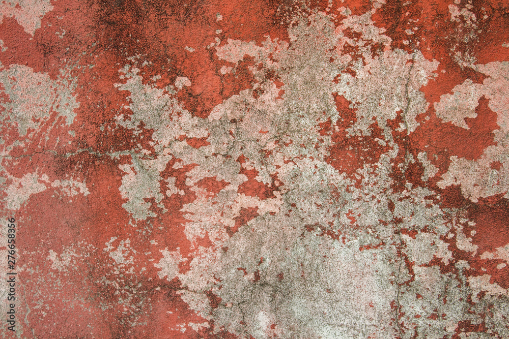 Old stone wall with plaster, worn paint and mold. Can be used as a texture, background or wallpaper
