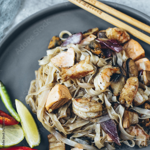 Noodles wok for Asian cooking with seafood