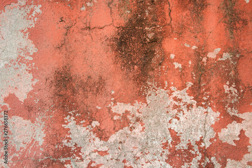 Old stone wall with plaster, worn paint and mold. Can be used as a texture, background or wallpaper