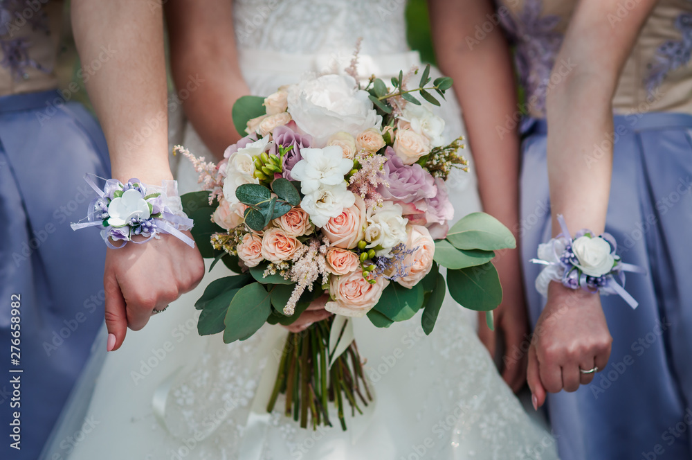 Bouquet of flowers in the hands of the girls Bouquet of flowers in the hands of the girls