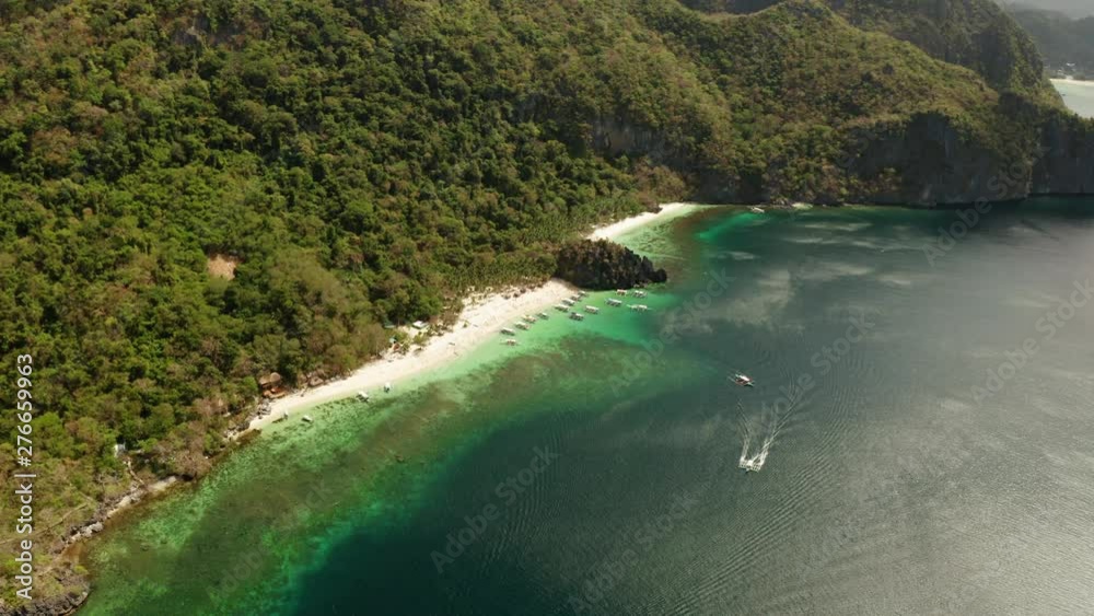 aerial view tropical lagoon with sandy beach. El nido, Philippines, Palawan. Seascape with tropical rocky islands, ocean blue water. Summer and travel vacation concept aerial view tropical lagoon with sandy beach. El nido, Philippines, Palawan. Seascape with tropical rocky islands, ocean blue water. Summer and travel vacation concept