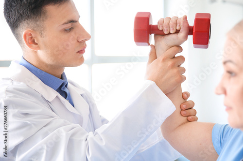 Physiotherapist working wit...