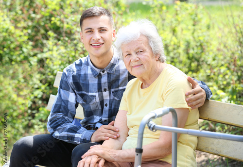 Grandson with senior woman in park