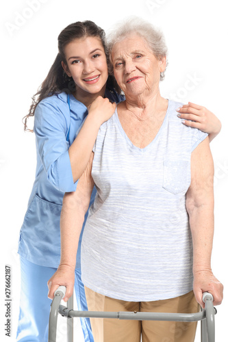 Young caregiver with senior...
