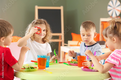 Cute little children eating...