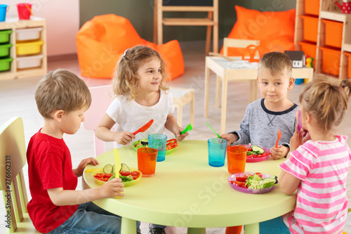 Cute little children eating...