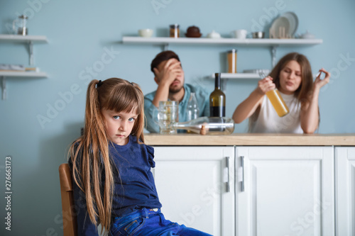 Sad little girl sitting on ...