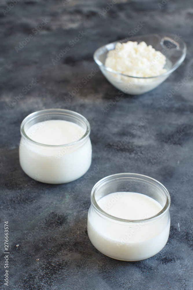 Fermented drink kefir in small bottles and kefir grains Fermented drink kefir in small bottles and kefir grains