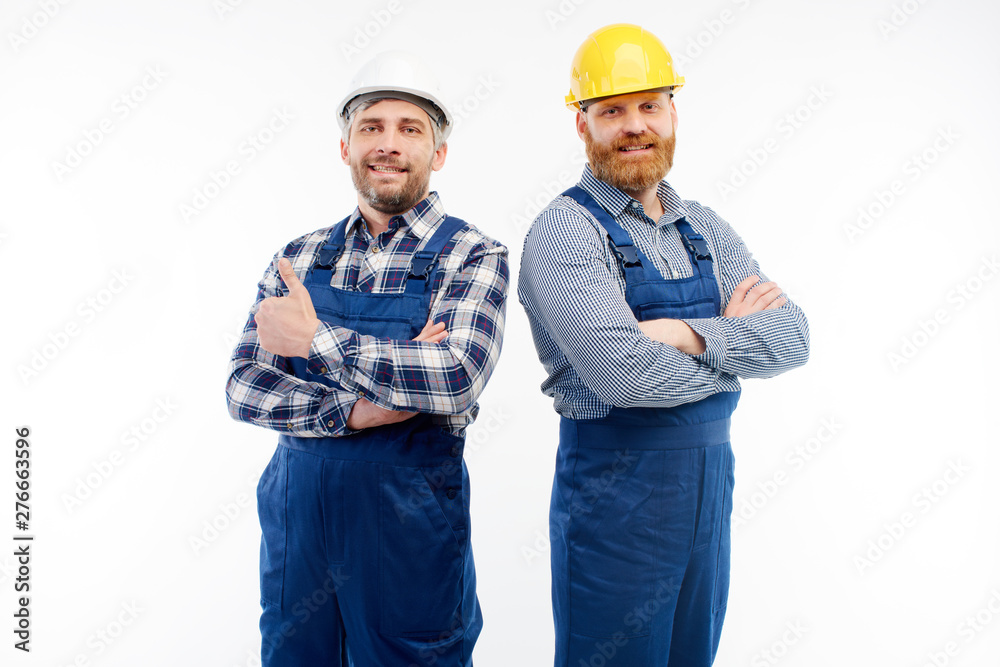 Two engineers smiling at camera on white background Two engineers smiling at camera on white background