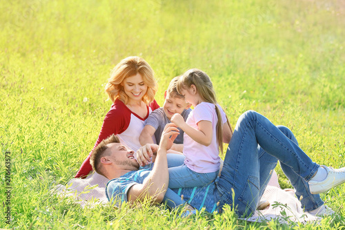 Happy family resting in park © Pixel-Shot