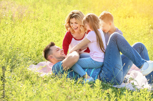 Happy family resting in park © Pixel-Shot