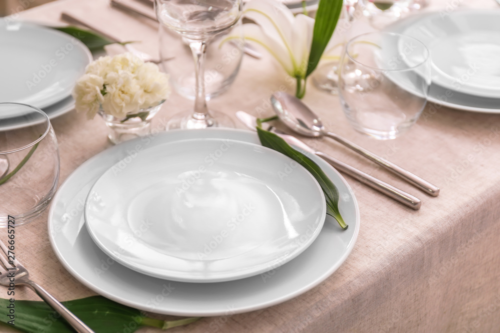 Beautiful festive table setting with flowers Beautiful festive table setting with flowers