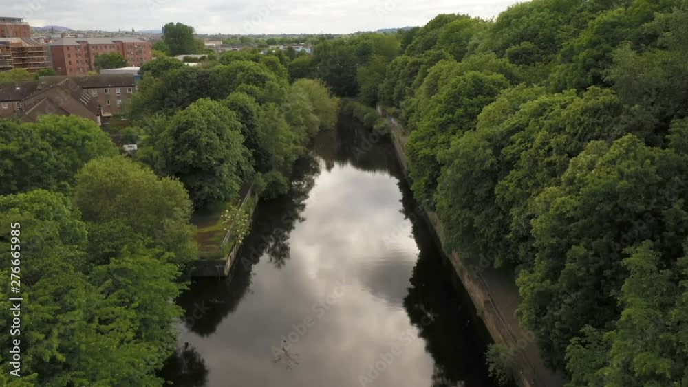 A smooth drone shot travelling down a city river banked with trees | The Water of Leith, Edinburgh, Scotland | Shot in 4k at 30 fps A smooth drone shot travelling down a city river banked with trees | The Water of Leith, Edinburgh, Scotland | Shot in 4k at 30 fps