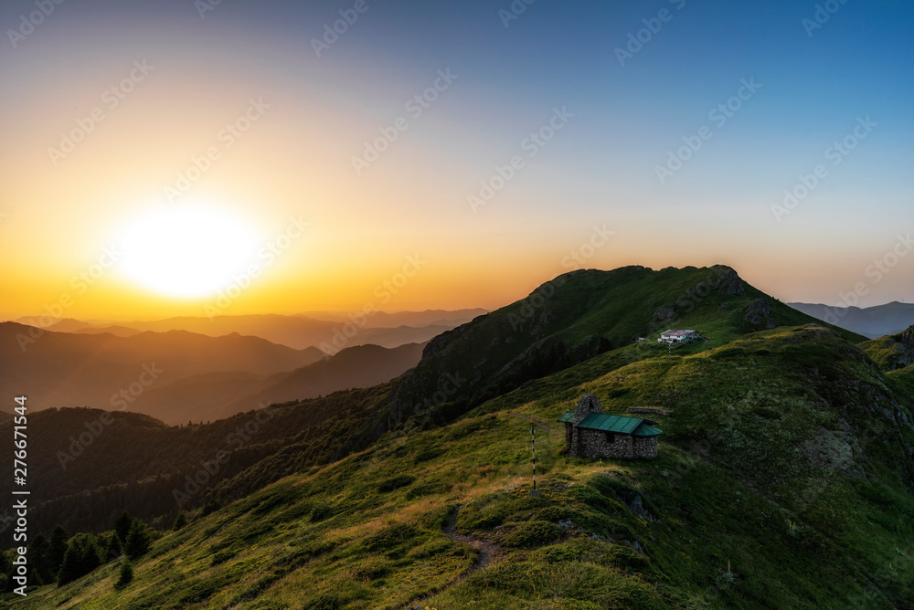 Beautiful clear sky summer sunset in the mountains. Landscape with sun light shining Beautiful clear sky summer sunset in the mountains. Landscape with sun light shining