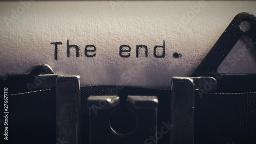The word 'the end' being typed on a vintage typewriter. Can be used as the end title for a movie.