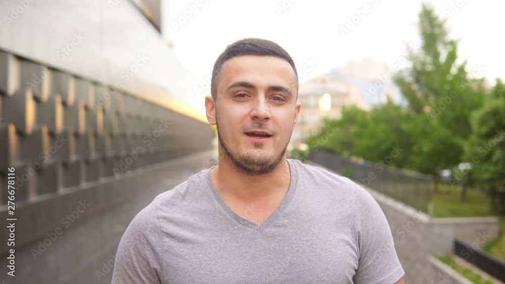 Happy jewish man talking to camera on the street Happy jewish man talking to camera on the street