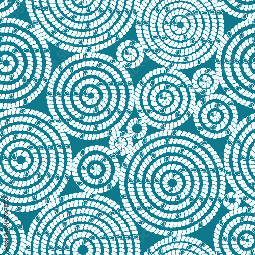 Seamless pattern with circles. Circles, tiles, bricks, imitation of embroidery. Abstract white circles on a turquoise background. Ideal for textiles, fabrics, clothing design, paper.