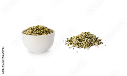Hemp seeds isolated on white. Bowl with hemp seeds isolated on white background. Peeled raw hemp seeds in bowl.