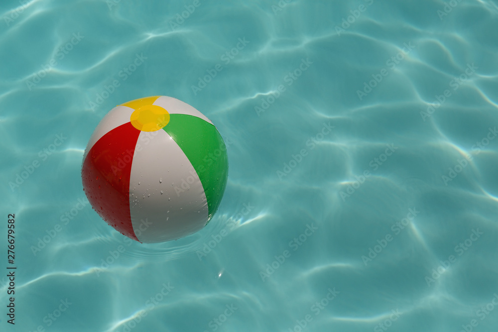 Inflatable ball floating in swimming pool