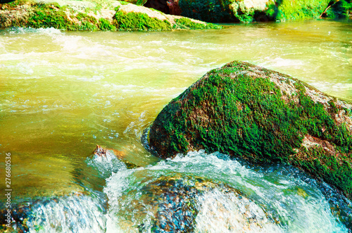 Beautiful scenic landscape of Aisttal valley on the Aist river in Upper Austria in summer. Bright sunlight vibrant greenery moss on rocks roaring flowing water. Travel wanderlust concept photo
