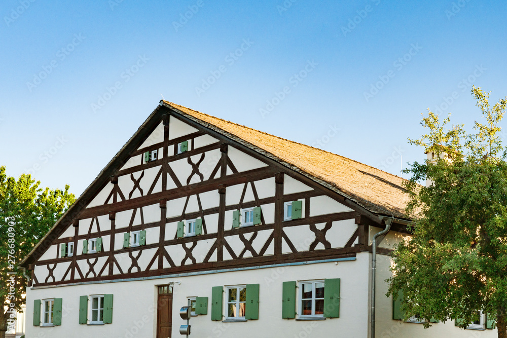 facade of half timbered house with shutters in Denkendorf, Germany facade of half timbered house with shutters in Denkendorf, Germany