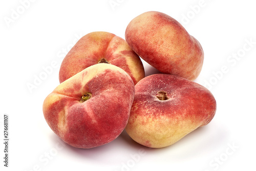Flat Peaches, ripe nectarines, close-up, isolated on white background