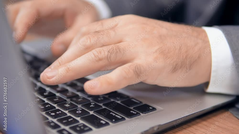Strong Hands Of Man Typing On Modern Laptop. Preparing Presentation. Wearing Shirt And Suit. Business Concept. Strong Hands Of Man Typing On Modern Laptop. Preparing Presentation. Wearing Shirt And Suit. Business Concept.