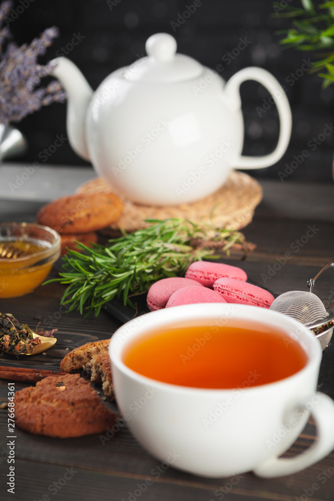 glass teapot with cup of black tea on wooden table glass teapot with cup of black tea on wooden table