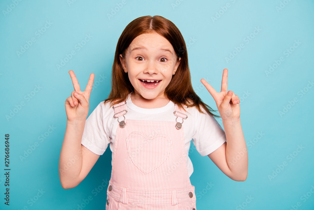 Portrait of cheerful cute kid make v-signs two laugh laughter isolated blue background Portrait of cheerful cute kid make v-signs two laugh laughter isolated blue background