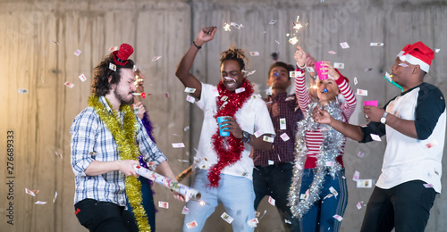 multiethnic group of casual business people having confetti party