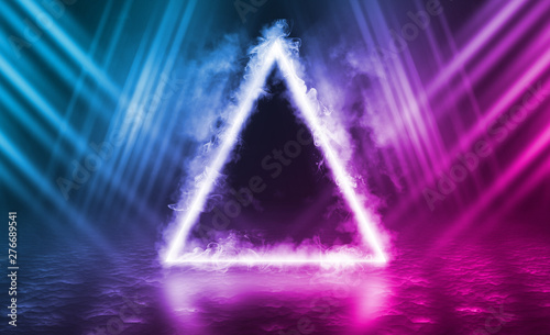 Empty background scene. Dark reflection of the street on the wet asphalt. Rays of neon light in the dark  neon figure of a triangle  smoke. Background of empty stage show. Abstract dark background.