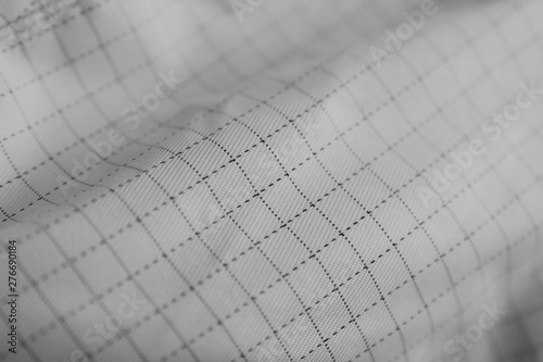 fabric with a pattern in the cell blurred image ,black and white