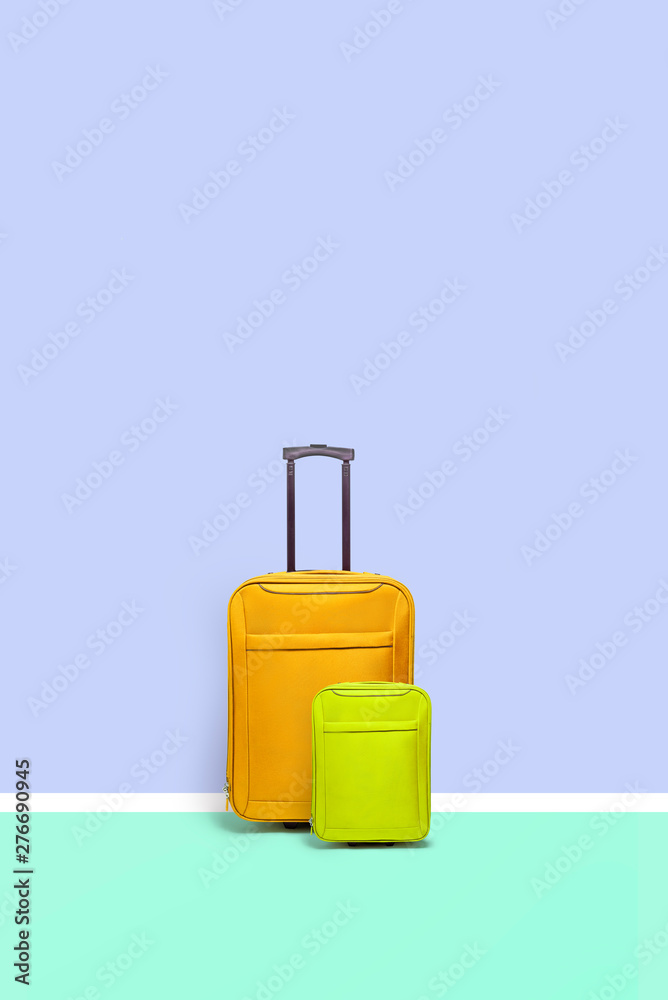 Set of suitcases standing on blue background. Travel concept