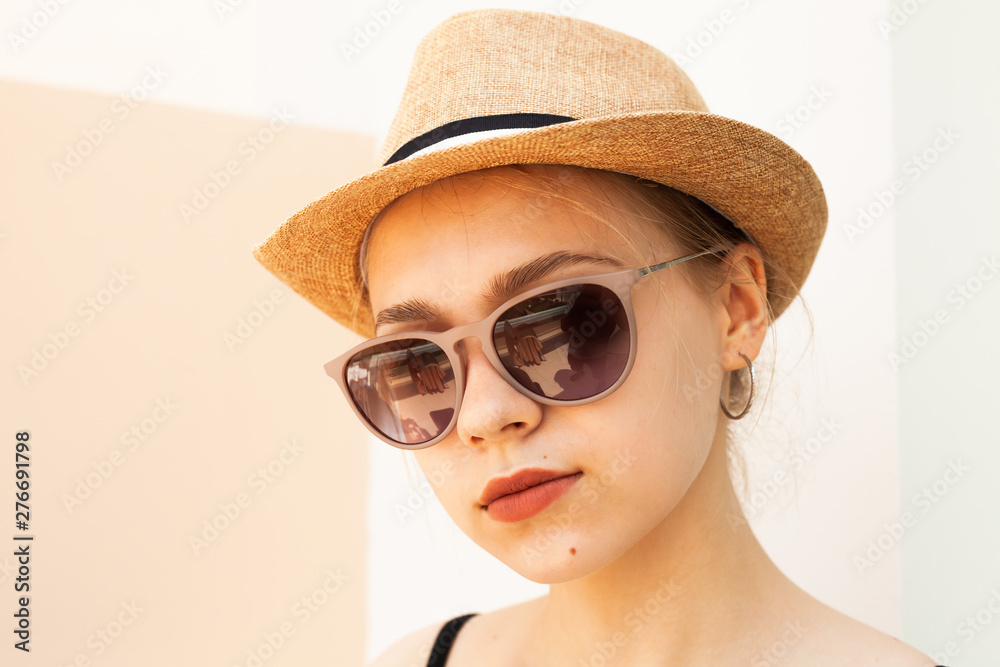 Girl in a straw hat and glasses Girl in a straw hat and glasses