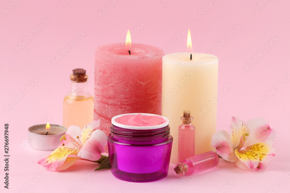 Spa. Aromatherapy. Body care cosmetics. aroma oils and cream on a gentle pink background