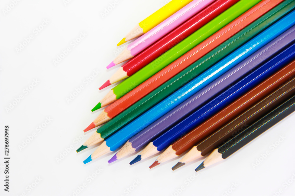 colorful wooden pencils for drawing on white background