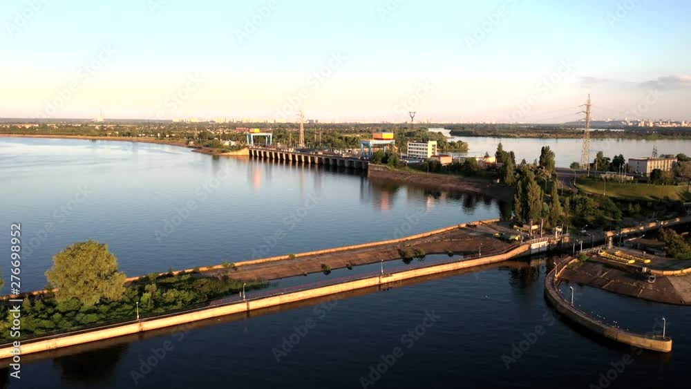 Aerial drone push-in shot of the a bridge crossing the Dnieper River coast of the city of Kiev, Ukraine during sunset Aerial drone push-in shot of the a bridge crossing the Dnieper River coast of the city of Kiev, Ukraine during sunset