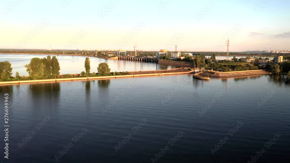 Aerial drone tracking shot of a white and blue cruise ferry boat ship sailing across the river in Kiev, Ukraine Aerial drone tracking shot of a white and blue cruise ferry boat ship sailing across the river in Kiev, Ukraine