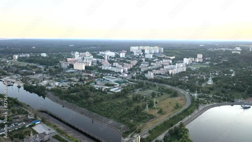 Aerial drone push-in shot of the Dnieper River coast of the city of Kiev, Ukraine during sunset Aerial drone push-in shot of the Dnieper River coast of the city of Kiev, Ukraine during sunset